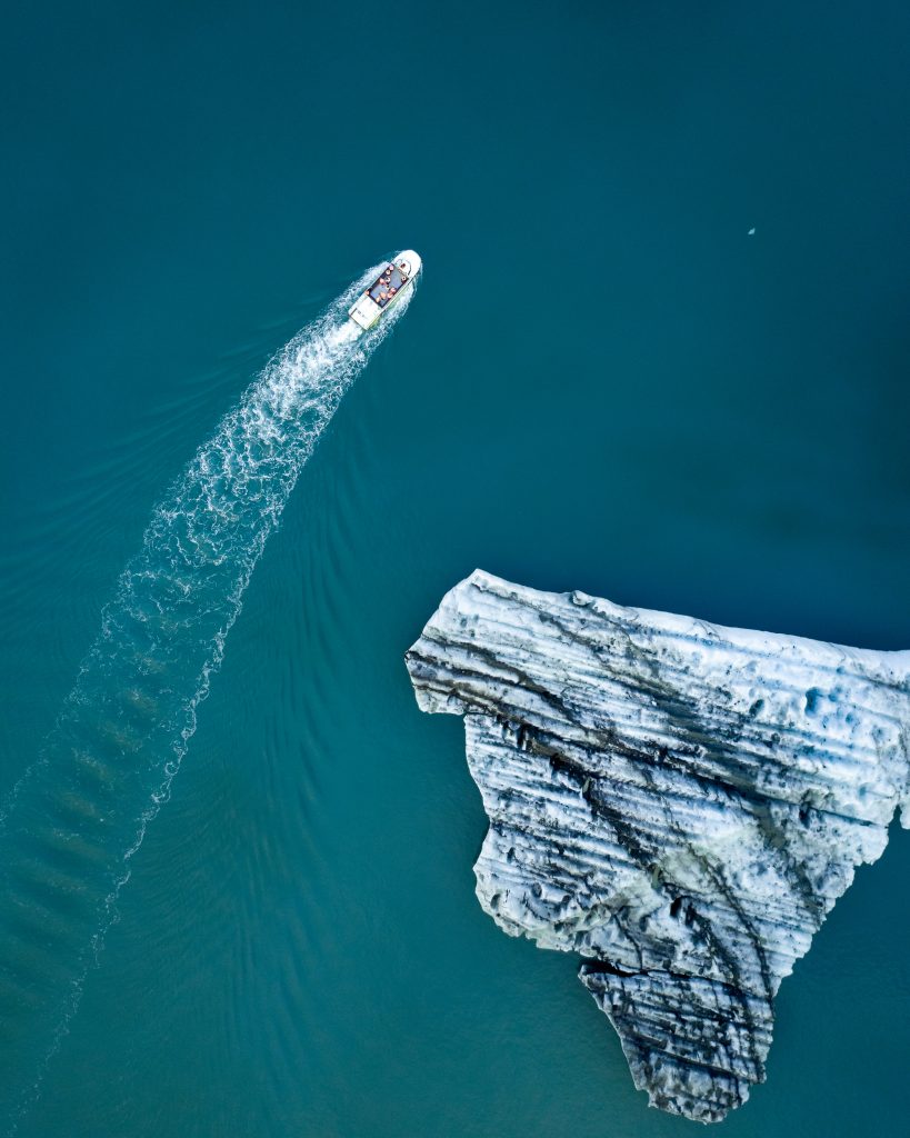 Amphibian boat sailing around icebergs in Jokulsarlon